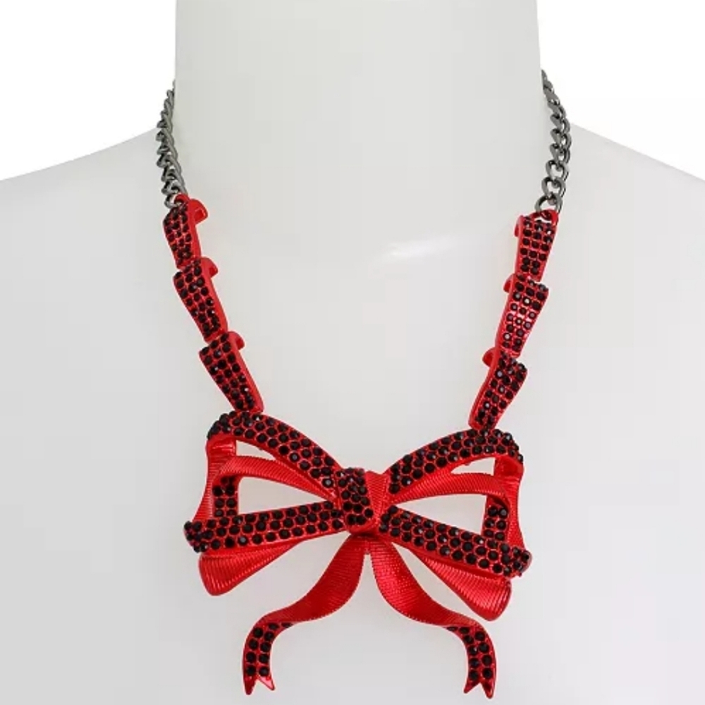 Betsey Johnson necklace featuring festive vibrant red fancy flowy bow pendant